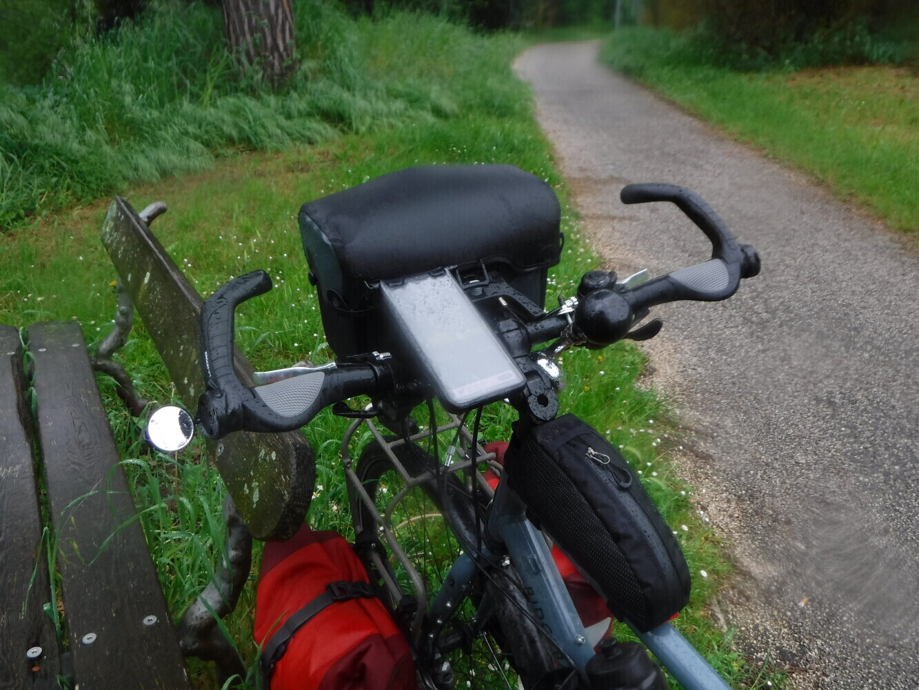Waterproof and ready to go through the downpour. The fold-out convex mirror on the left side is one of my favourite bits on the bike, perfect for watching close overtakes by Italian drivers